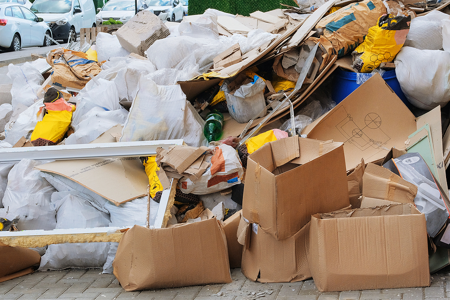 Garbage pile, ecology contamination with plastic and construction garbage. Trash heap. Removal of debris.